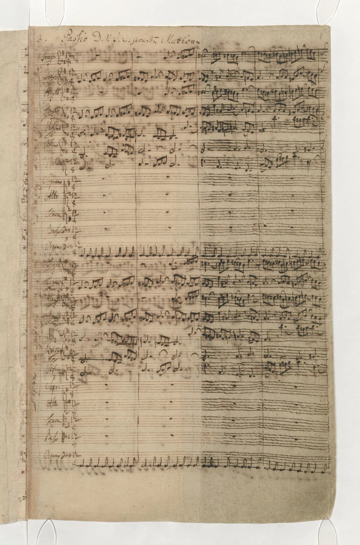 The first page of the autograph score, ruled staves filled in a fast brown hand, with the caption title written across the head of the leaf.